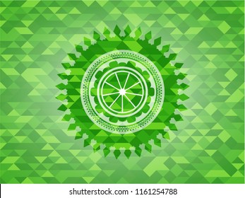 orange icon inside green emblem. Mosaic background