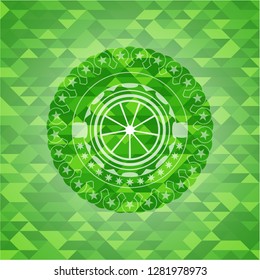 orange icon inside green emblem with triangle mosaic background