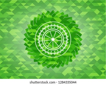 orange icon inside green emblem with mosaic background