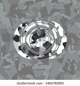 orange icon inside grey camo emblem