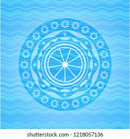 orange icon inside light blue water wave emblem background.