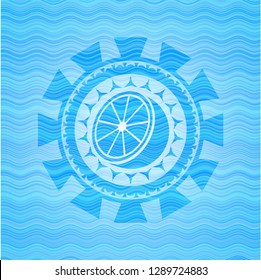 orange icon inside light blue water wave badge background.