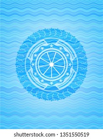 orange icon inside light blue water wave emblem background.
