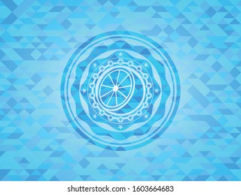 orange icon inside light blue emblem with mosaic background