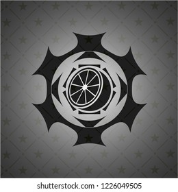 orange icon inside realistic black emblem
