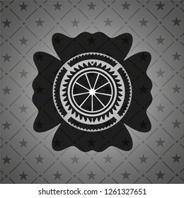 orange icon inside realistic black emblem