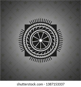 orange icon inside realistic black emblem