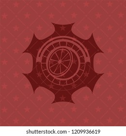 orange icon inside realistic red emblem
