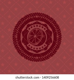orange icon inside realistic red emblem