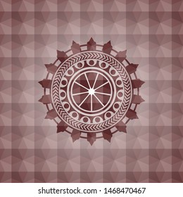 orange icon inside red seamless emblem or badge with abstract geometric polygonal pattern background.