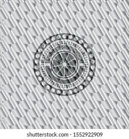 orange icon inside silver emblem or badge. Scales pattern. Vector Illustration. Detailed.