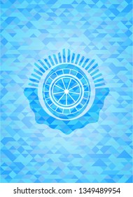orange icon inside sky blue emblem with triangle mosaic background