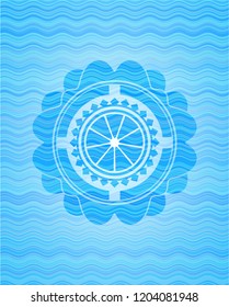 orange icon inside water wave emblem.