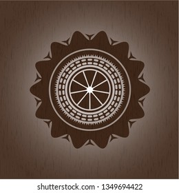 orange icon inside wooden emblem. Vintage.