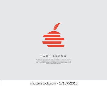 an orange icon with a leaf that can be used as a logo  