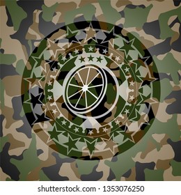 orange icon on camouflage pattern
