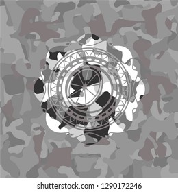 orange icon on grey camo texture