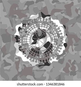 orange icon on grey camo texture