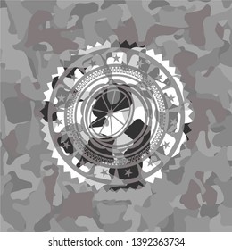 orange icon on grey camo pattern