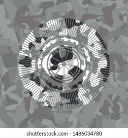 orange icon on grey camo pattern