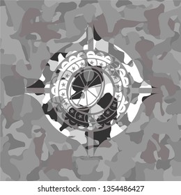 orange icon on grey camouflage texture