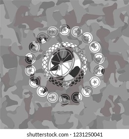orange icon on grey camouflaged pattern