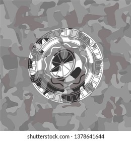 orange icon on grey camouflaged pattern
