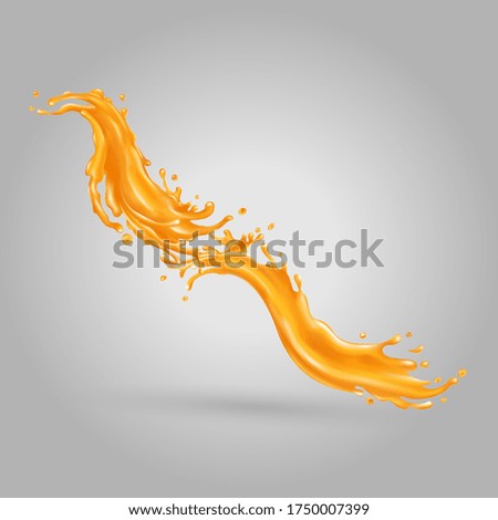 Orange juice splashes on a gray background