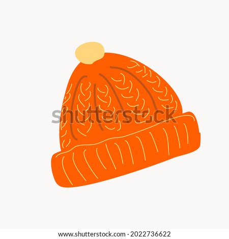 Orange knitted warm hat with a pompom. Isolated element on a white background.