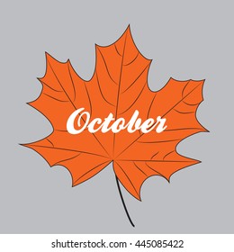 Orange maple leaf with inscription october isolated on gray background.
