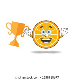 Orange mascot character with a trophy in right hand. vector illustration