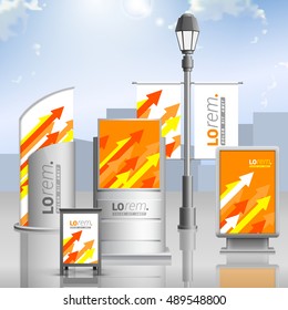 Orange outdoor advertising design for corporate identity with red, yellow and white arrows. Stationery set