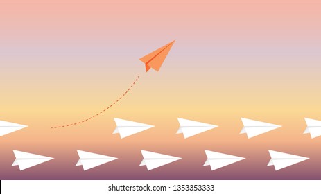 Orange plane changes direction. New idea, change, trend, courage, creative decision, innovation and unique concept of the path.