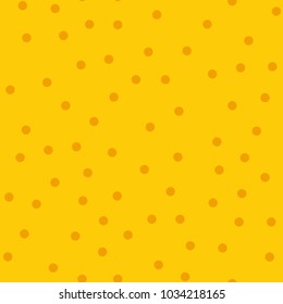 Orange polka dots seamless pattern on yellow background.
