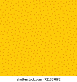 Orange polka dots seamless pattern on yellow background.