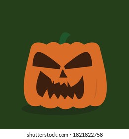 orange pumpkin on green color background