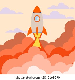 An orange rocket floats in the sky. Concept for start up business