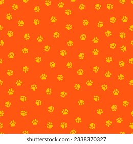 Orange seamless pattern with yellow paws