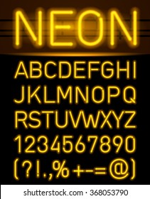 Orange set neon font and symbols isolated on black