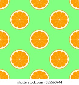 Orange slices on green background seamless pattern