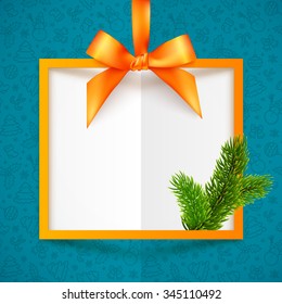 Orange squared frame with ribbon, bow and fir tree branch at blue Christmas pattern background