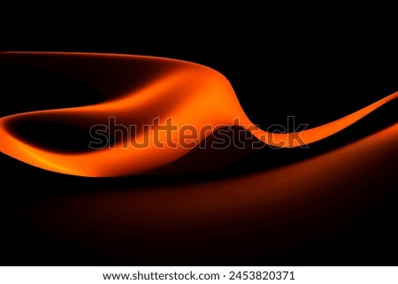 Orange wave on black background with elegant lines and waves.