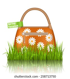 Orange woman spring bag with chamomiles flowers and spring vacation sticker in grass lawn with reflection on white background