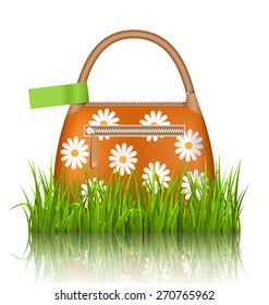 Orange woman spring bag with chamomiles flowers and green sticker in grass lawn with reflection on white background