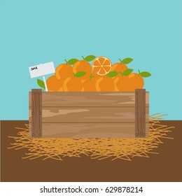 Orange in a wooden crate