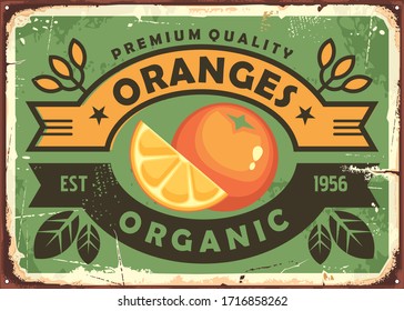 Oranges vintage sign. Organic fruit farm poster template with slice of orange, leaves and ribbons. Vector nostalgic banner.