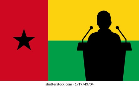 Orador Hablando Desde La Bandera Del Tribune Guinea-Bissau. Discurso Del Orador Público En Guinea-Bissau. Concepto de la Conferencia de Presentación de Empresarios.