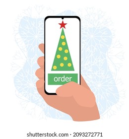 order a Christmas tree through an application in a smartphone in hand.