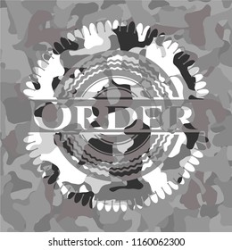 Order on grey camouflaged texture