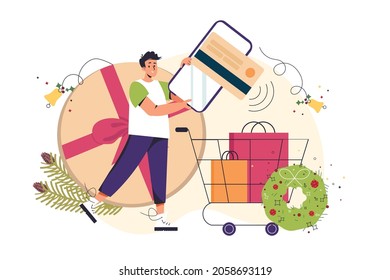 Ordering christmas gifts online vector illustration concept. Man holding mobile with credit card and cart with purchase and decorations. Online shopping concept. Holidays and celebrations banner.